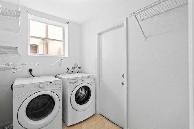 clothes washing area with independent washer and dryer