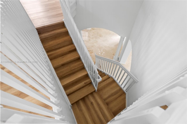 staircase featuring hardwood / wood-style flooring