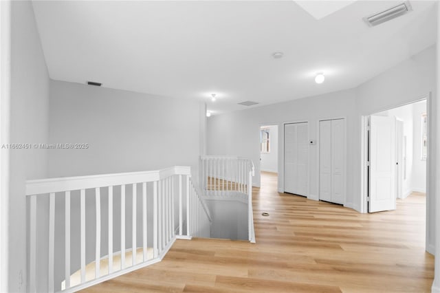 corridor featuring hardwood / wood-style floors