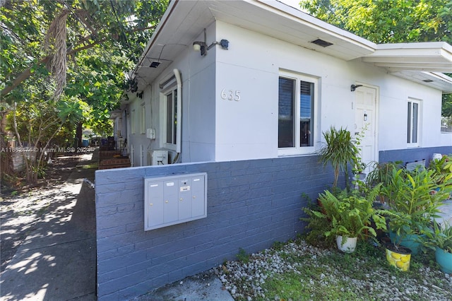 view of property exterior featuring concrete block siding