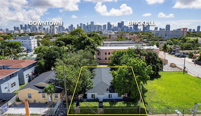 birds eye view of property with a view of city