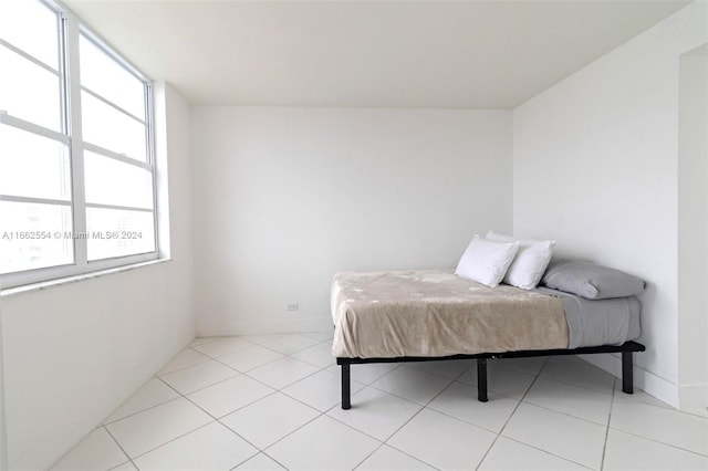 bedroom with light tile patterned floors