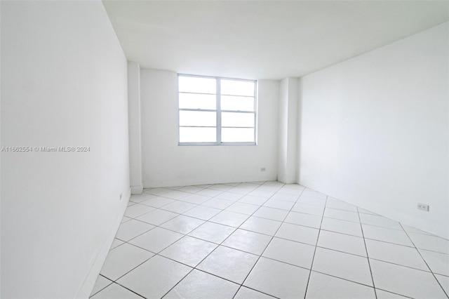 spare room with light tile patterned floors