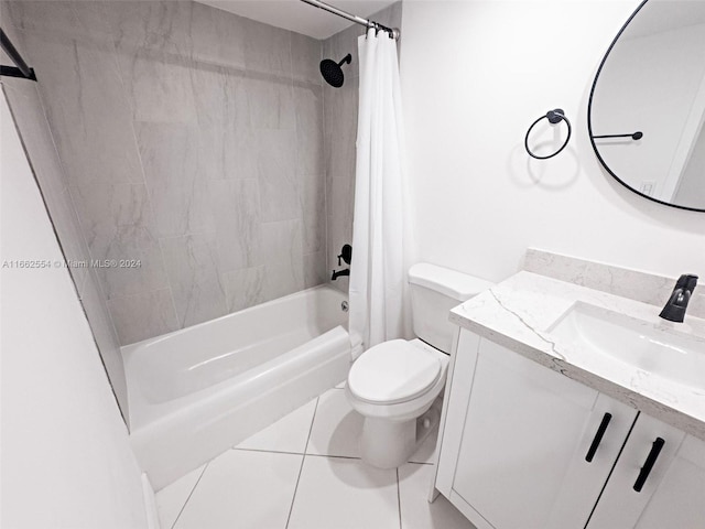 full bathroom featuring tile patterned flooring, vanity, toilet, and shower / bath combo with shower curtain