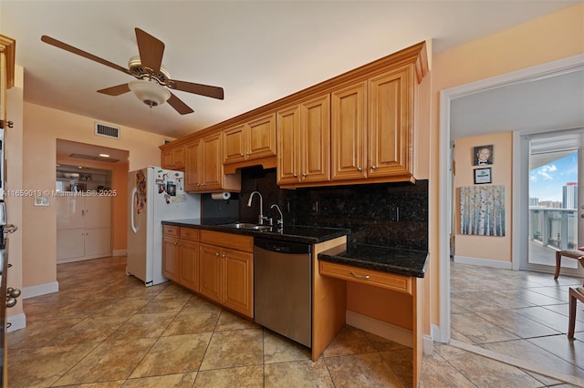 kitchen featuring dishwasher, white fridge, sink, backsplash, and ceiling fan