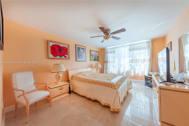 bedroom featuring ceiling fan and light tile patterned floors