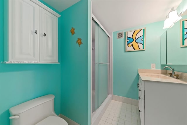 bathroom featuring vanity, toilet, and walk in shower