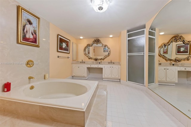 bathroom with vanity, tile patterned floors, and shower with separate bathtub