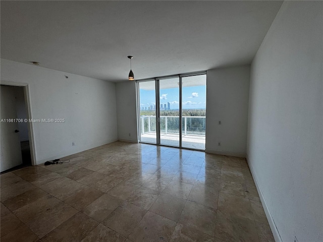 14951 Royal Oaks Ln Unit 1504, North Miami, FL 33181 - unfurnished room with a wall of windows, baseboards, and a water view