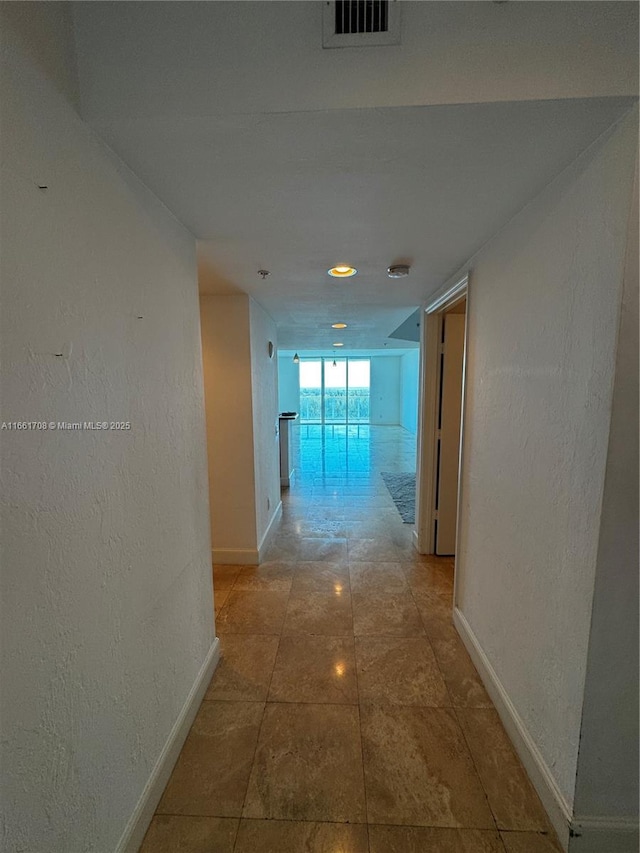 14951 Royal Oaks Ln Unit 1504, North Miami, FL 33181 - hall featuring baseboards and a textured wall