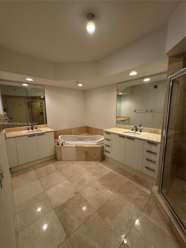14951 Royal Oaks Ln Unit 1504, North Miami, FL 33181 - bathroom featuring a stall shower, a bath, two vanities, recessed lighting, and tile patterned flooring