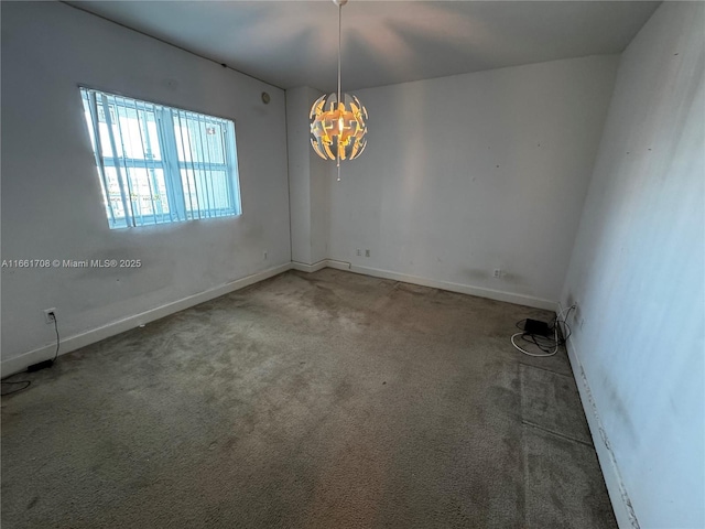 14951 Royal Oaks Ln Unit 1504, North Miami, FL 33181 - carpeted empty room with a chandelier and baseboards