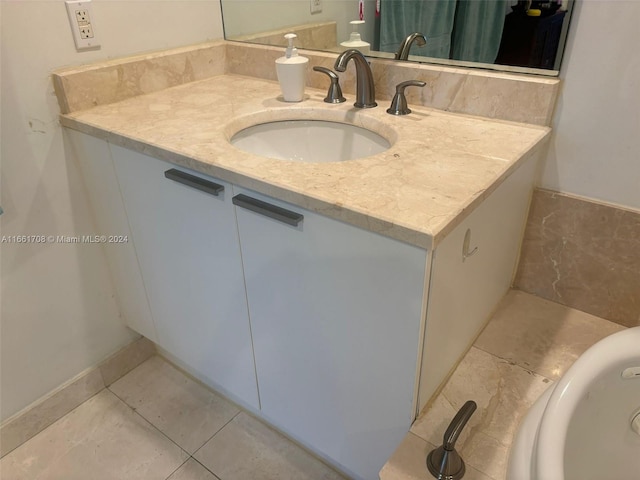 bathroom with tile patterned flooring and vanity