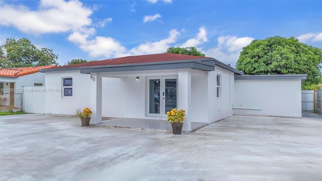 view of side of home featuring a patio area