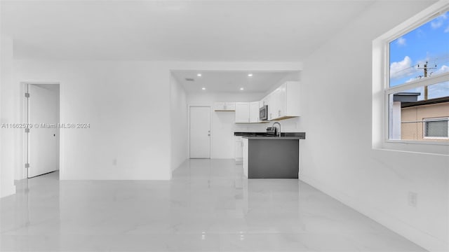 kitchen with white cabinets and sink