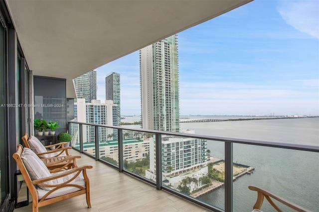 balcony featuring a water view