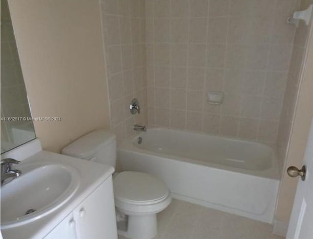 full bathroom featuring vanity, toilet, and tiled shower / bath