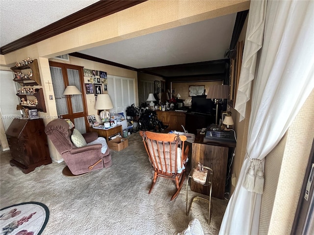 living room featuring carpet floors, a textured ceiling, and ornamental molding