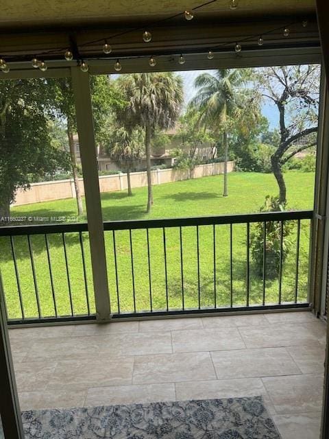 unfurnished sunroom featuring a wealth of natural light