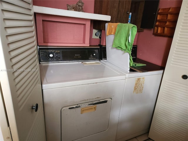 laundry area with washing machine and dryer