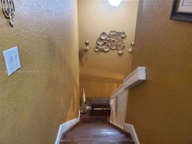 stairway featuring hardwood / wood-style flooring