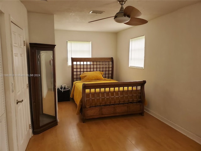 bedroom featuring wood-type flooring and ceiling fan