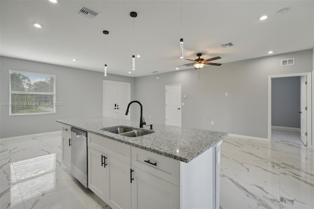 kitchen featuring ceiling fan, light stone counters, sink, stainless steel dishwasher, and white cabinetry