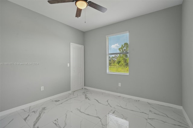 unfurnished room with ceiling fan