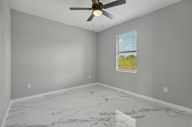 spare room with ceiling fan