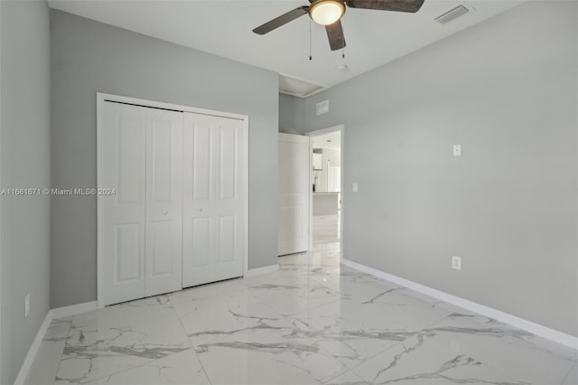 unfurnished bedroom featuring a closet and ceiling fan