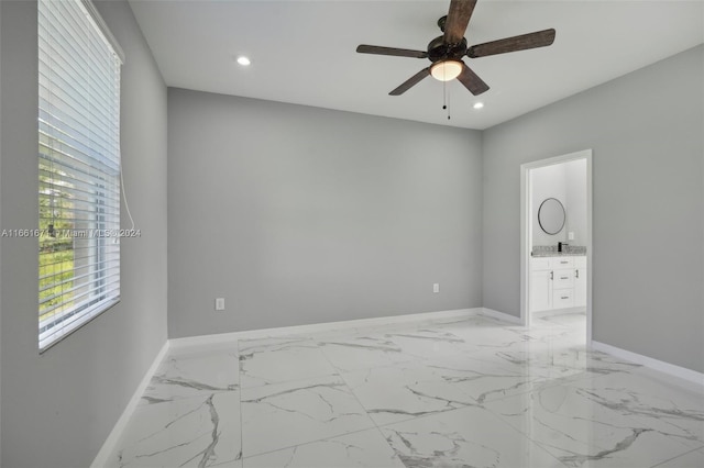 spare room featuring ceiling fan