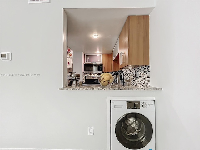 laundry area featuring washer / clothes dryer