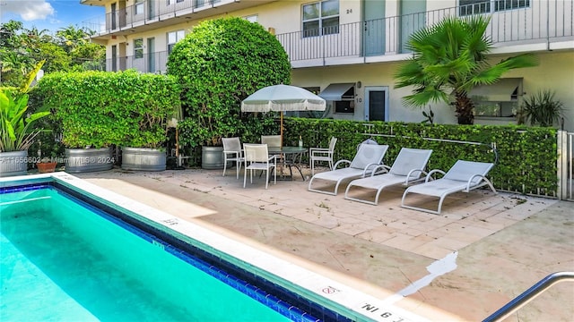 pool with a patio