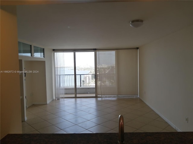 empty room with light tile patterned floors