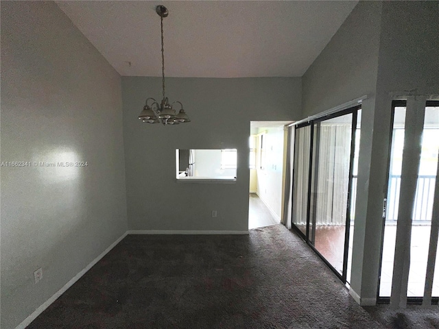 unfurnished dining area with dark carpet, lofted ceiling, and plenty of natural light