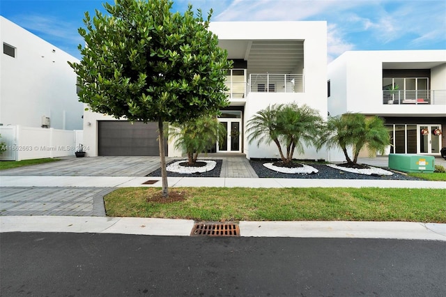 view of front of house with a balcony and central air condition unit