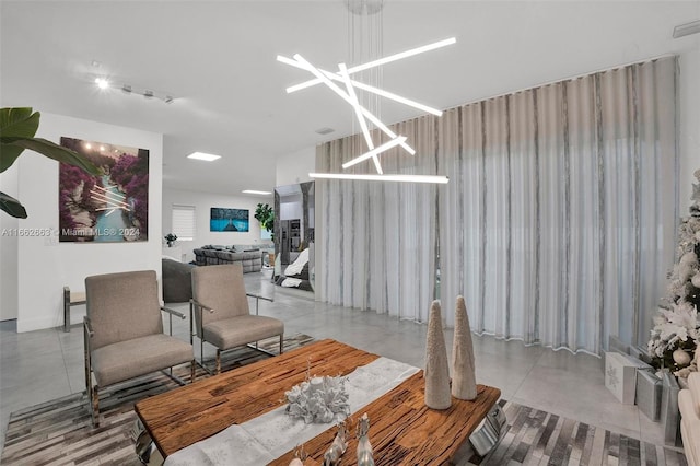 dining space with an inviting chandelier