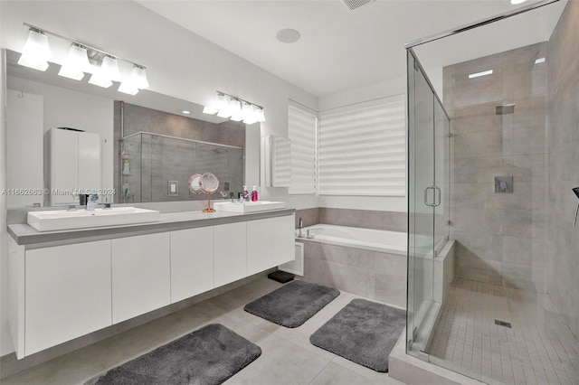 bathroom with vanity, separate shower and tub, and tile patterned floors