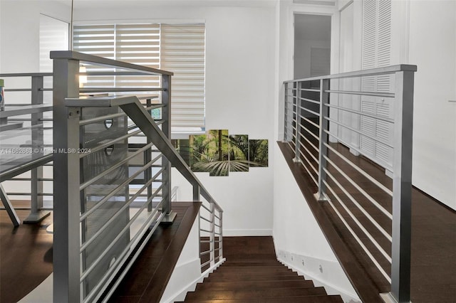 stairway featuring hardwood / wood-style flooring