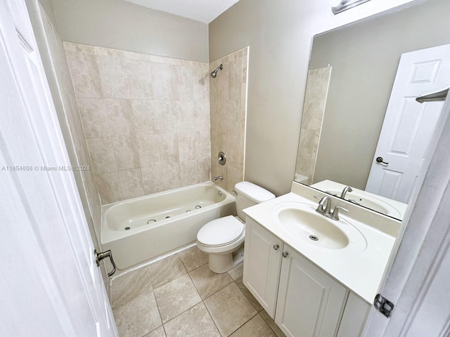 full bathroom with tiled shower / bath, vanity, toilet, and tile patterned floors