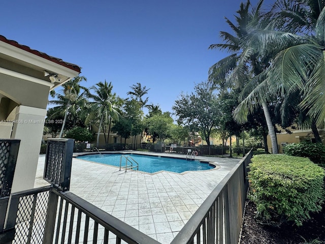 view of swimming pool featuring a patio