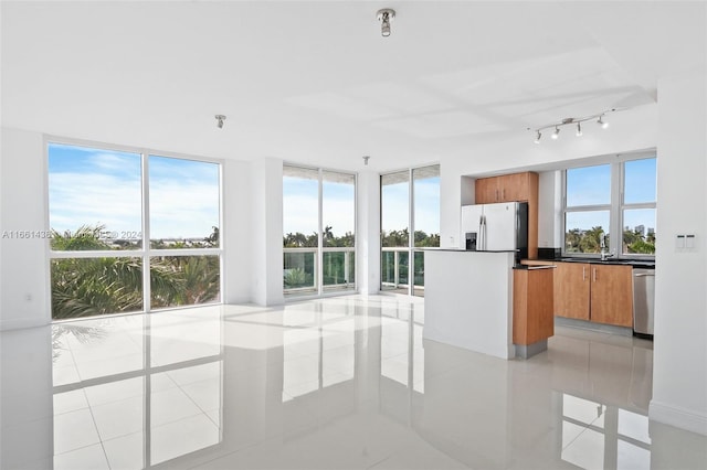 kitchen featuring appliances with stainless steel finishes and light tile patterned floors