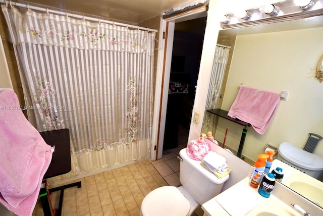 full bathroom featuring vanity, shower / tub combo, and toilet