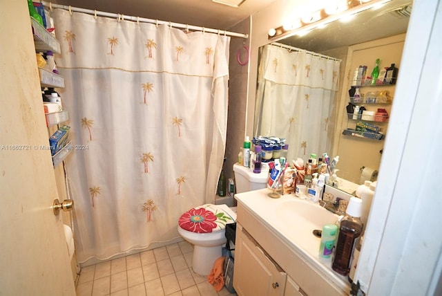 bathroom featuring tile patterned flooring, a shower with curtain, vanity, and toilet