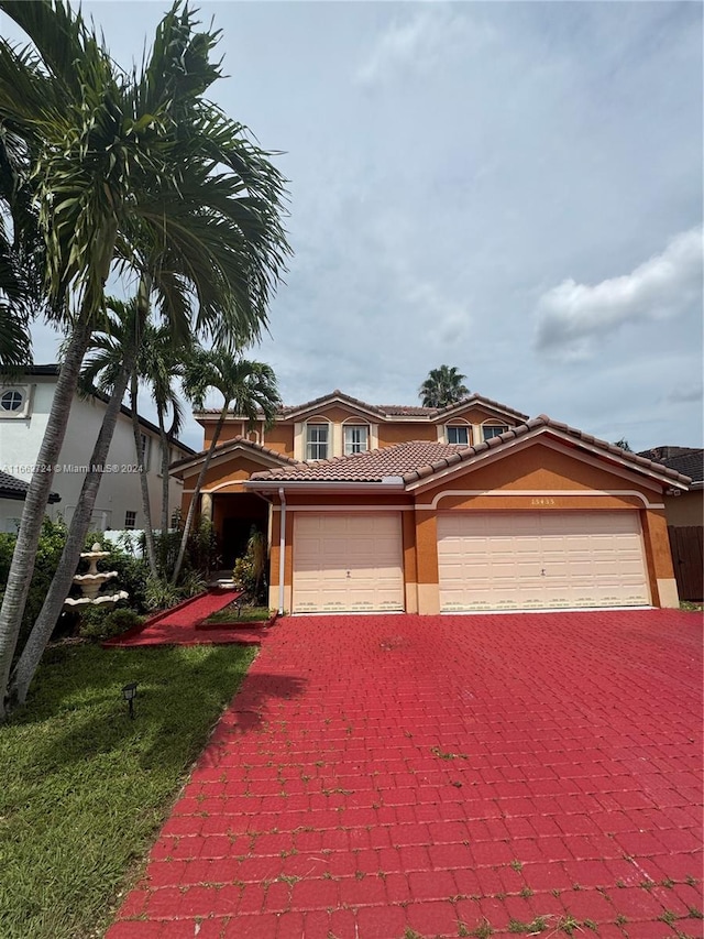 view of front of house featuring a front yard and a garage