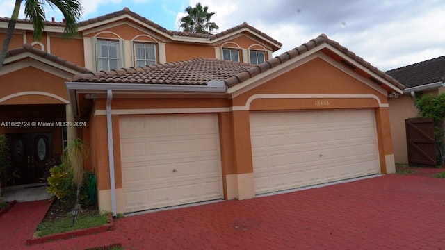 view of front of property with a garage