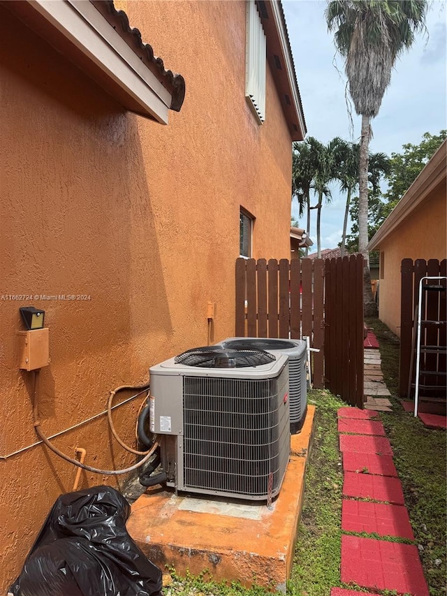 view of side of home featuring central AC unit