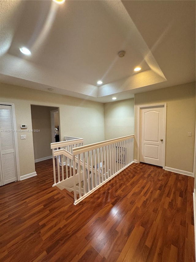 empty room with dark wood-type flooring