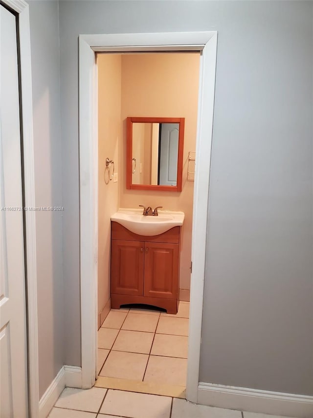 bathroom featuring tile patterned flooring and vanity