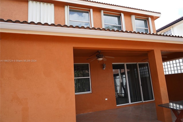 exterior space featuring ceiling fan and a patio area